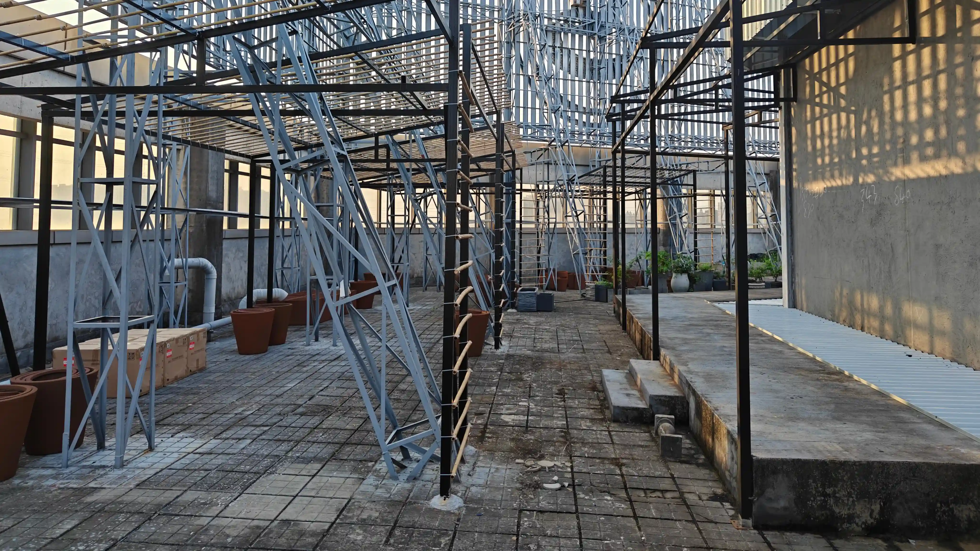 Early rooftop framework and planter layout during the construction of Vinca Garden